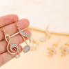 Golden Music Symbol Earrings Dangle Design for Music Lovers - Delicate & Unique Fashion Accessory