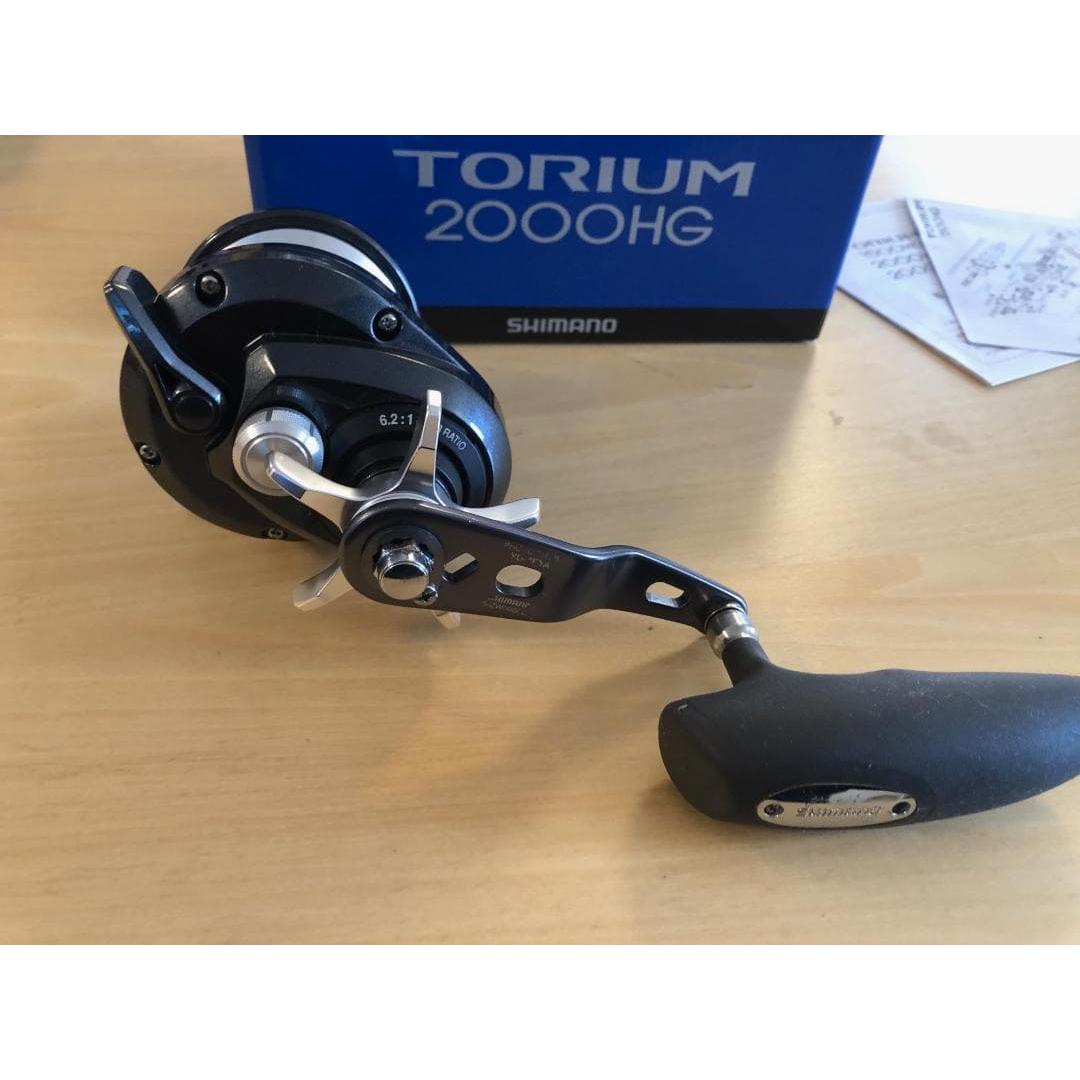 Used SHIMANO TORIUM 2000HG with power handle, right hand drive, used item