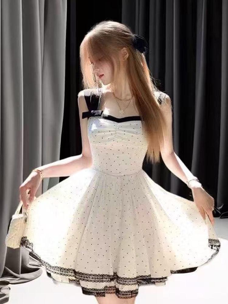 Women's French Retro Polka Dot Spaghetti Strap Dress - Elegant Summer Style with Waist-Cinch and Long, Slimming Hem
