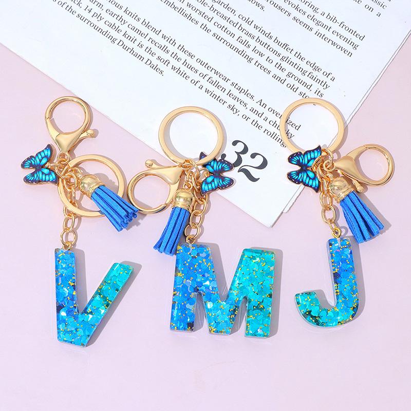 1 Stück Schriftzug Schlüsselanhänger für Rucksackanhänger Schlüsselanhänger Schlüsselring mit Quaste Schmetterling Niedlich Farbverlauf Harz Blau Pailletten