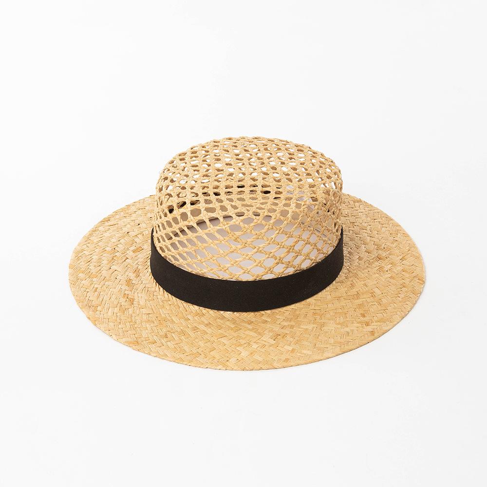 European and American spring and summer new fashion casual hand-woven hollow fleece webbing raffia flat top hat outdoor sunshade straw hat