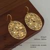 Retro ethnic style oval flower tag earrings hollow relief mosaic metal earrings exotic literary and high-end earrings