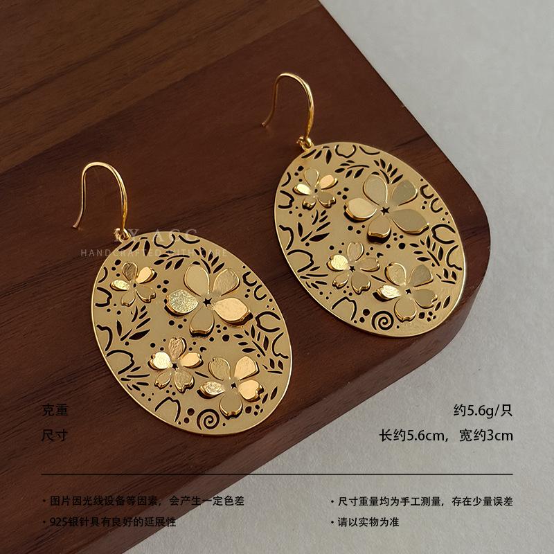 Retro ethnic style oval flower tag earrings hollow relief mosaic metal earrings exotic literary and high-end earrings