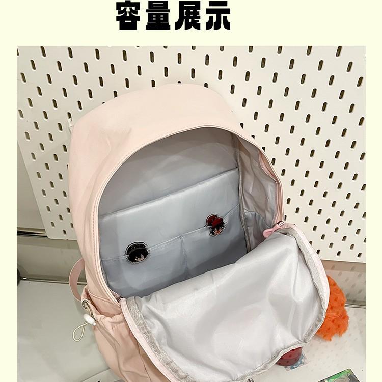 Solid color simple casual backpack female niche design sense lightweight size backpack class primary and secondary school students schoolbag