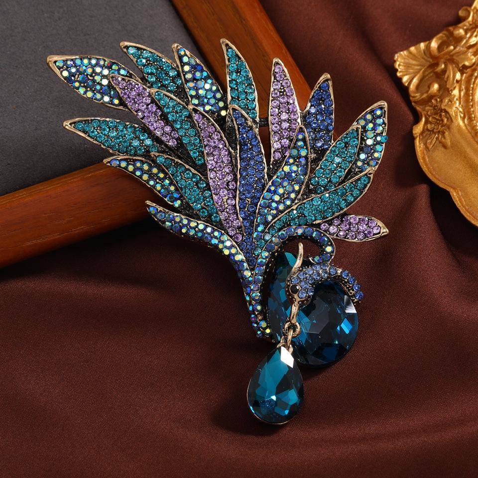 

Преувеличенная брошь в европейском и американском стиле со стразами в виде павлина и феникса для модного женского пальто и банкетной корсажной бутоньерки