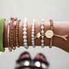 Korean version of multi-element Eiffel Tower pearl retro bracelet, coin six-piece jewelry multi-layer elastic bracelet
