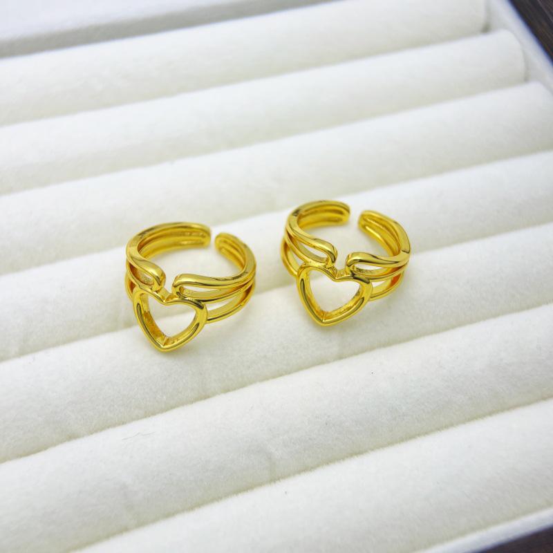 Exaggerated European Hollow Heart Gold-Plated Copper Ring - Fashionable, Long-Lasting, Unique Design for Women