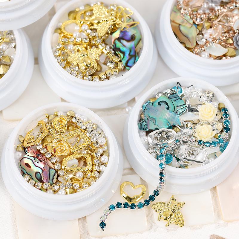 Dolphin Bay Nail Art: Shell Pieces, Rhinestones, Pearls, and Metal Chains Mixed Decorations