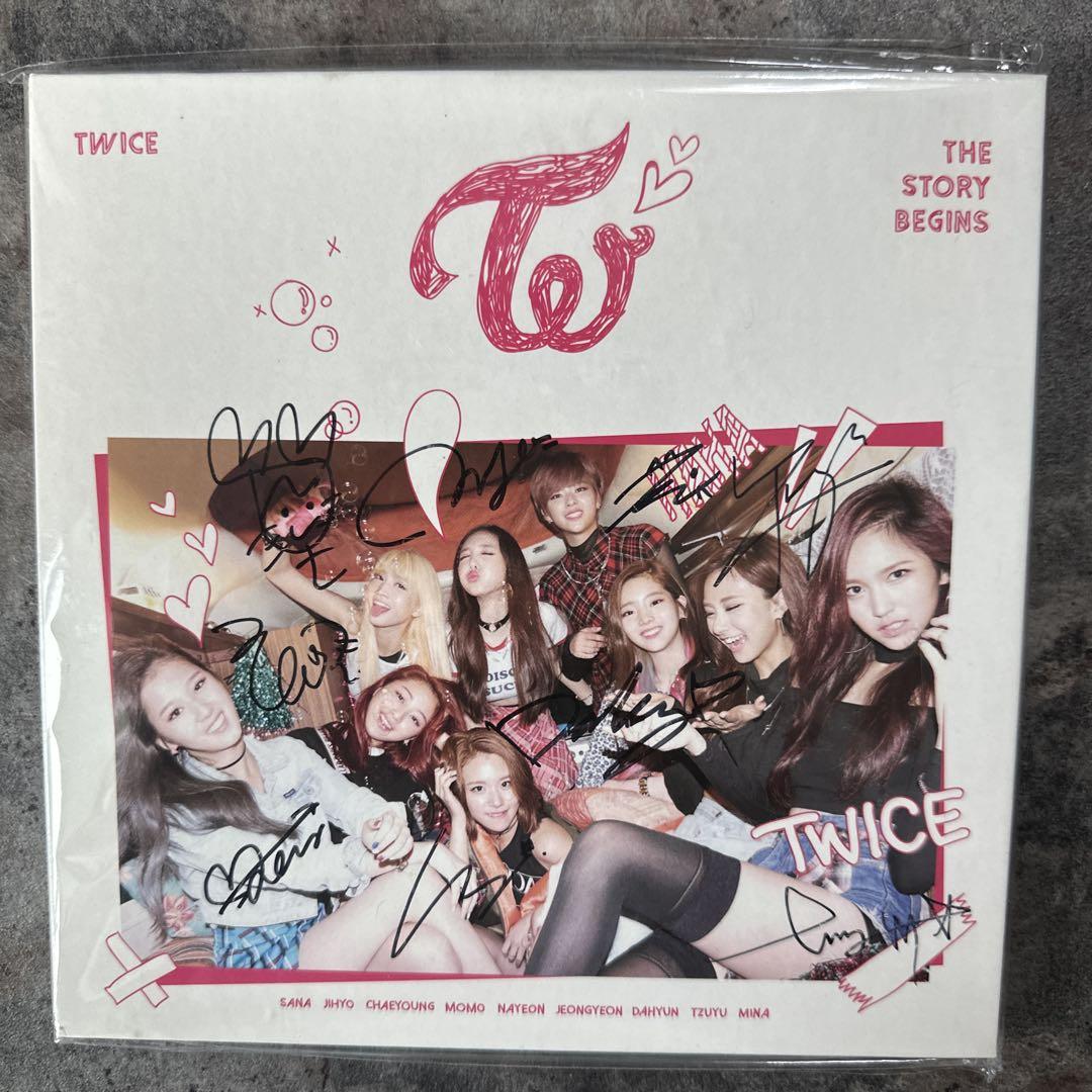 

[USED] TWICE autographed the story begins