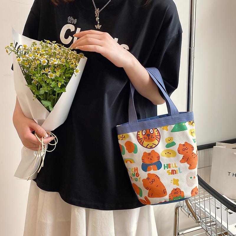 Cute little tiger illustration bucket bag 2025 new little fresh girl handbag simple bento bag woman