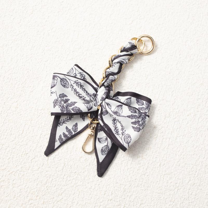 Elegant Hand-Woven Scarf Chain with Bow Decoration Pendant for Bag Strap Modification.