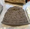 Handmade three-dimensional crochet sunflower crimped knitted hat for women with small faces, double-layer thickened warm ear protectors, pullover hat