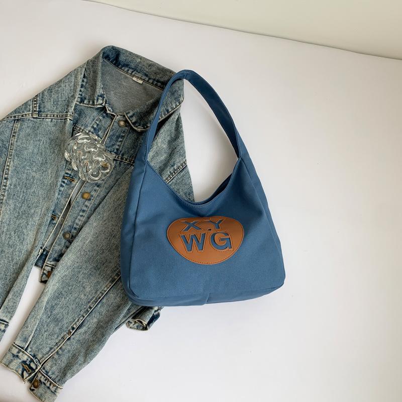 

Simple and fashionable tote shoulder foreign leisure commuter bag 2024 summer new trend beautiful shoulder bag синій