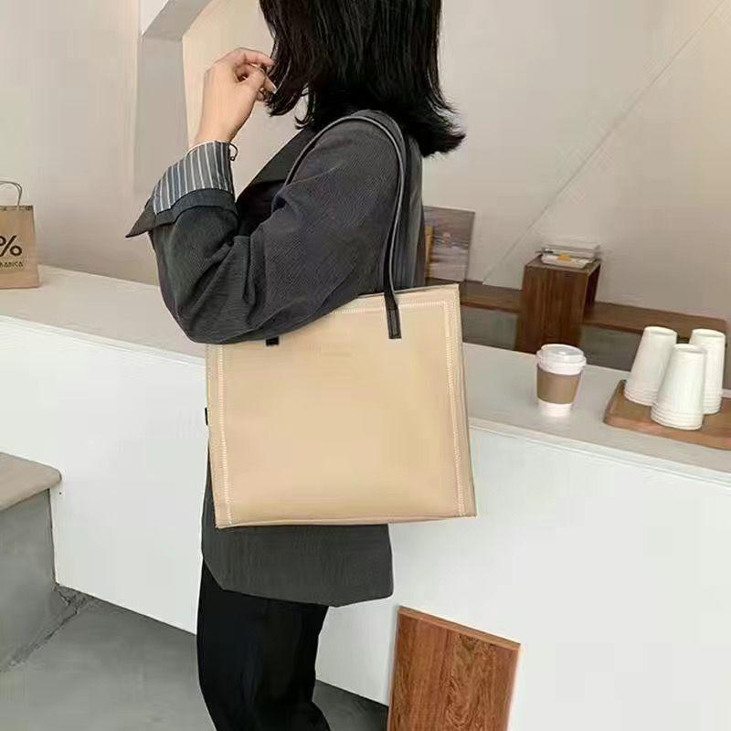 

Popular women s bags vertical 2025 new bags Korean version trendy commuter bags large-capacity portable tote bags