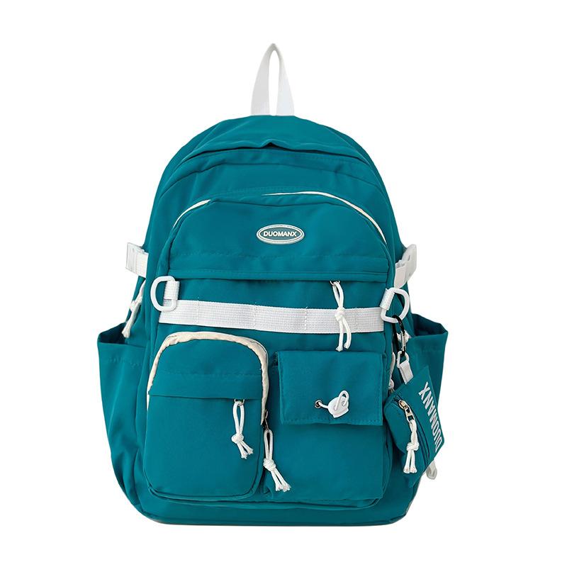 Simple solid color casual backpack high value junior high school student schoolbag large capacity versatile tooling backpack