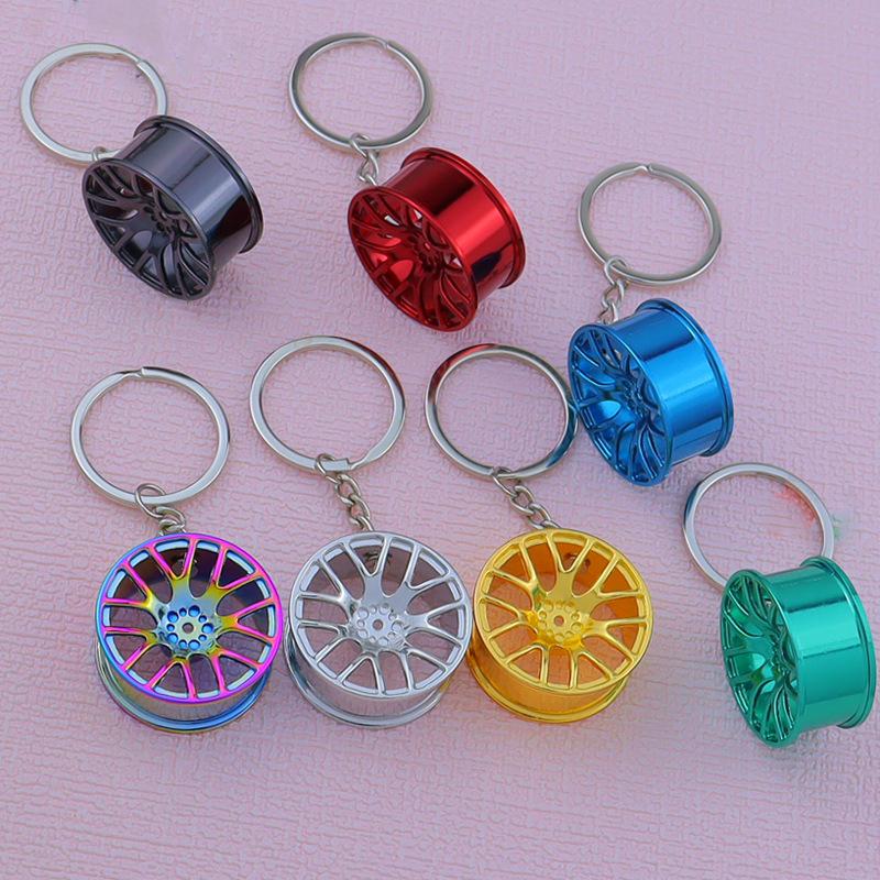 Creative Car Wheel Hub Keychain: Zinc Alloy Metal, Customizable Gift.