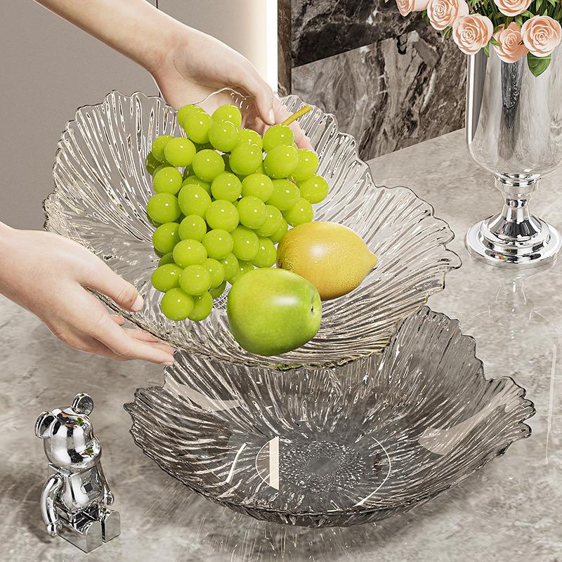 Transparente Obst- und Snack-Präsentationsplatte mit hohem Fuß: Modernes Licht-Luxus-Design für Wohnzimmer-Couchtische.