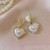 Pendientes de perlas de alta gama de moda Pendientes retro de nicho francés de lujo ligero Pendientes de perlas simples y versátiles para mujer