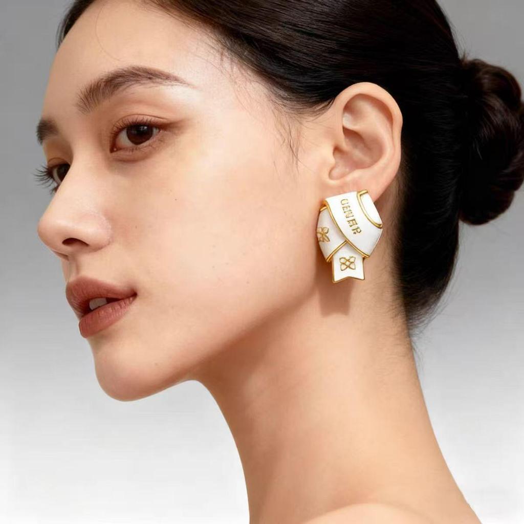 Black & Gold Enamel Twist Earrings: Versatile Luxury Studs for Autumn/Winter 2025