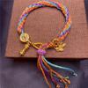 Woven Buddhist Bead Bracelet - A unisex hand-woven rope bracelet.
