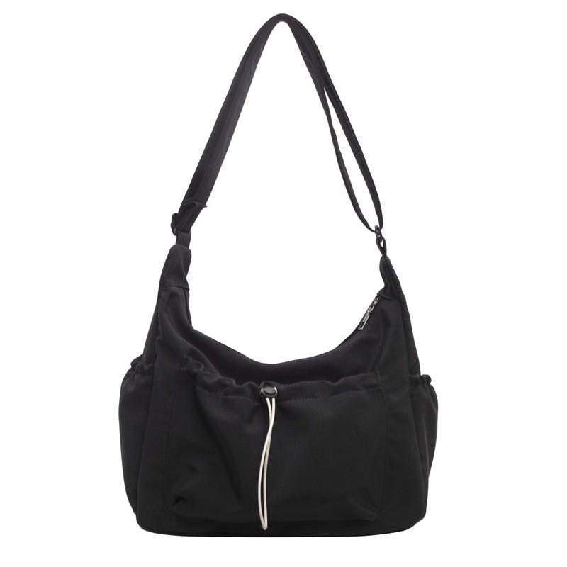 Canvas Ladies Crossbody Bag With Solid Color Drawstring Design For Daily Use And Urban Style