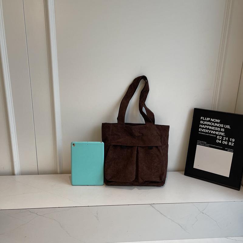 

Strip women s bag Korean version of college student shoulder bag multi-functional lightweight tote bag simple handbag large-capacity bag темно-коричневого кольору