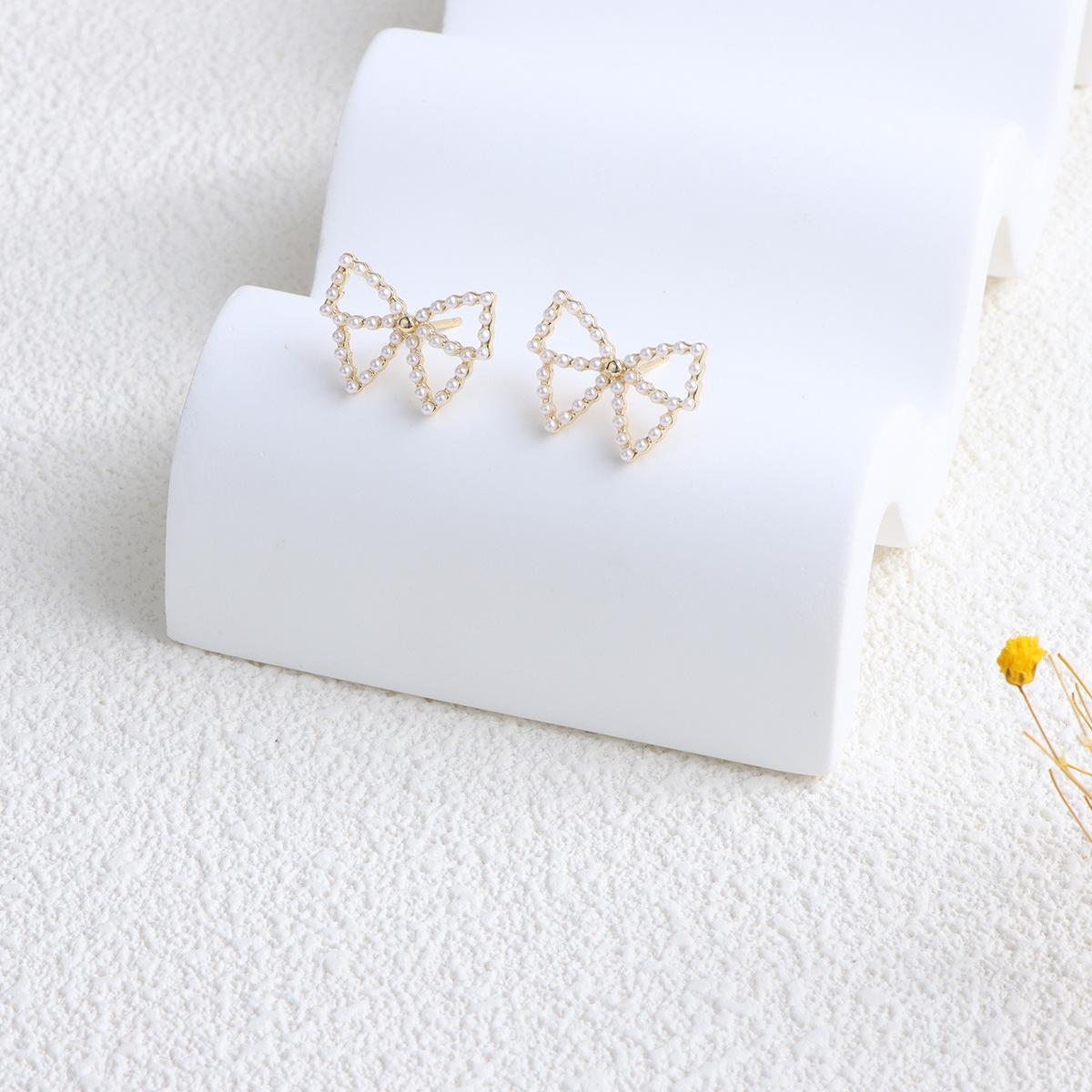New flower bow pearl earrings niche design super fairy pearl stud earrings simple versatile earrings