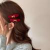 Red Velvet Bow-shaped Golden-label Hairpin As A New Year Hair Accessory for The Side of A Young Girl's Hair