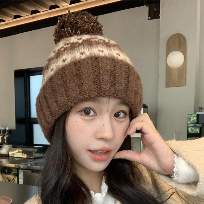 Winter new jacquard contrasting wool hat women's thickened warm windproof hat pullover hat cute hairball knitted hat