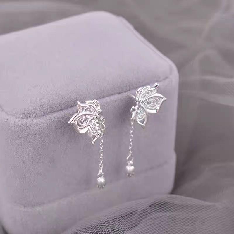 Hollow Lotus Seed Butterfly Tassel Earrings: Women's New Chinese Style, Luxurious Summer 2025 Niche Design.