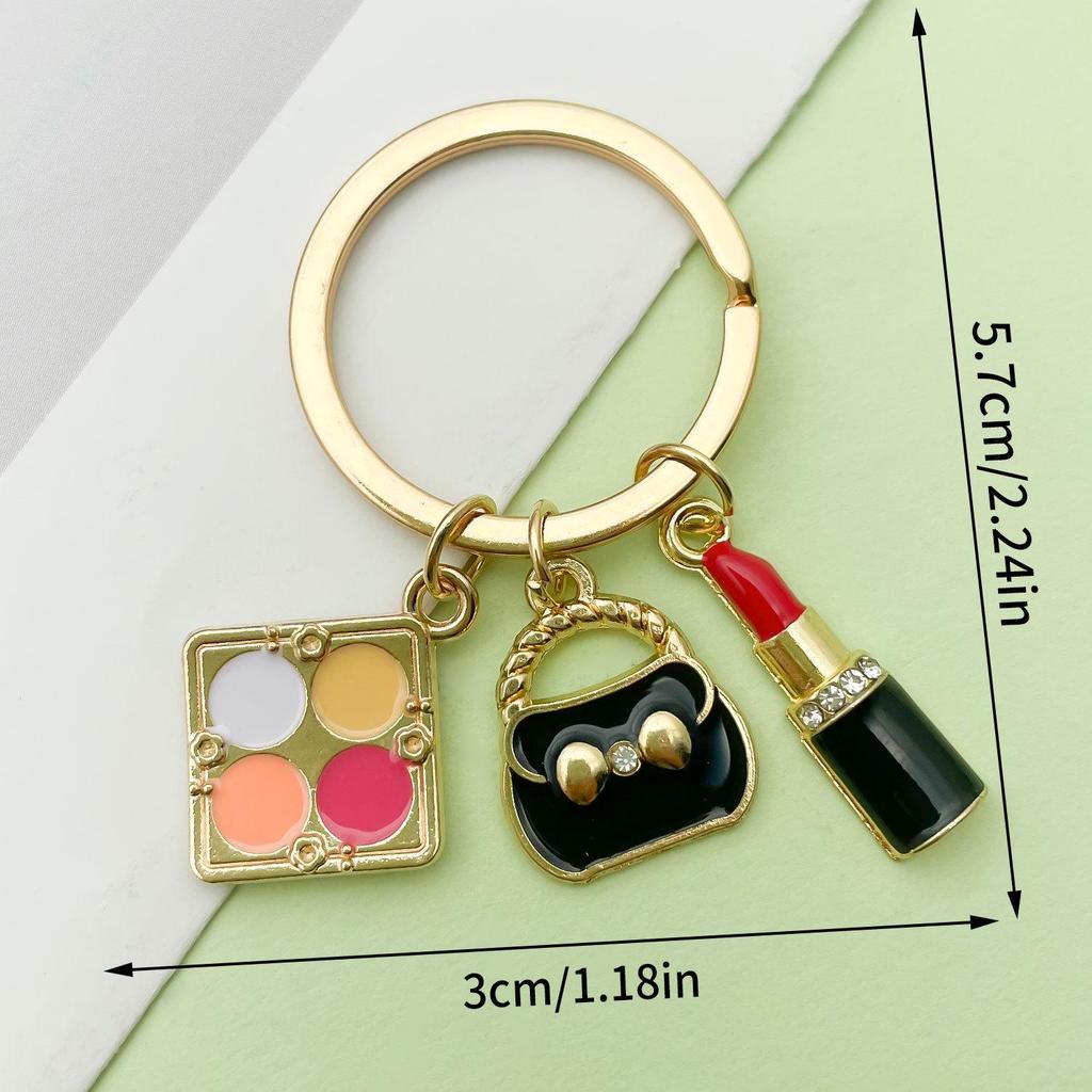 Schlüsselanhänger im koreanischen Stil aus schwarzer Legierung mit Lippenstiftanhänger und Perle