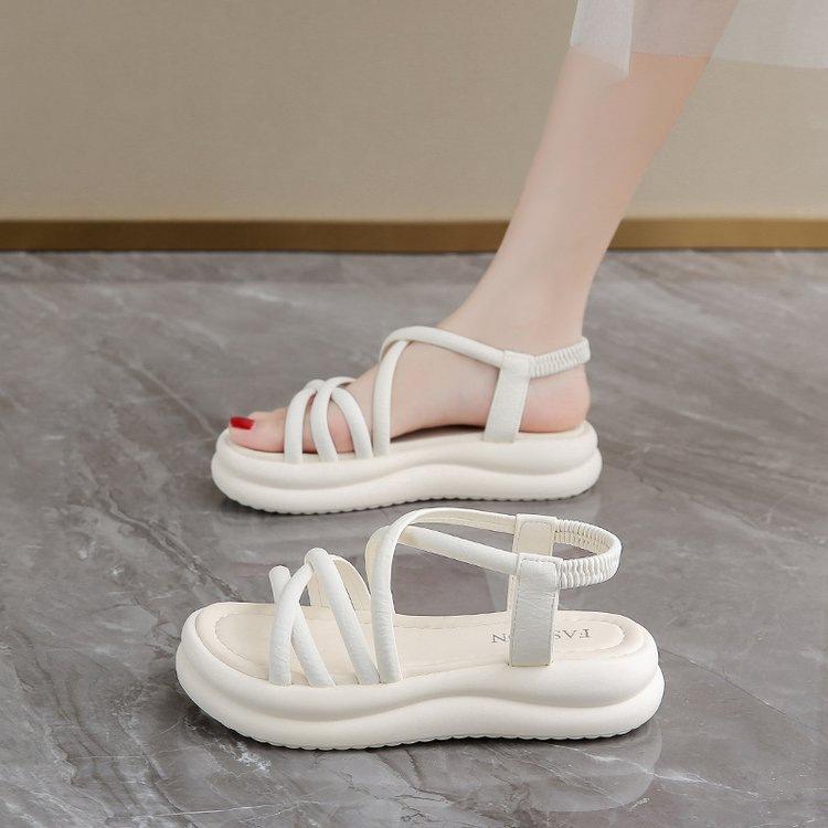 

thick-soled Roman sandals women s 2025 summer new outer wear soft sole with skirt fairy wind cross strap beach shoes 40