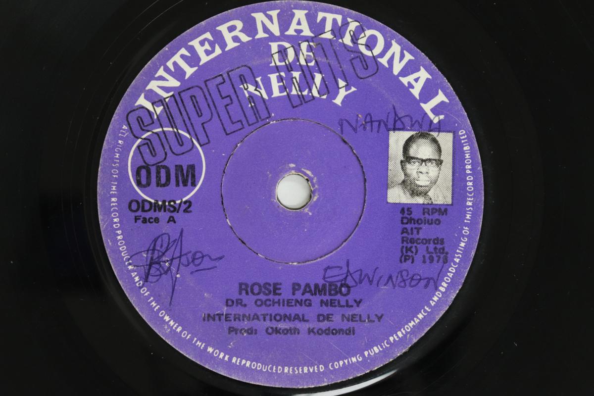 

7-дюймовая пластинка INTERNATIONAL DE NELLY - Rose Pambo / Watch Duto Minyalo ODMS2 International d Kenya Мировая музыка Б/У