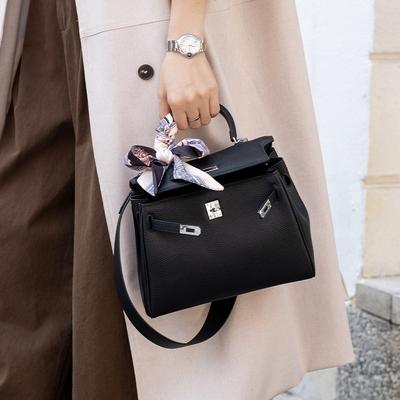 Bolso nuevo de alta gama con correa ancha para el hombro para mujer, patrón de lichi, bolso de mano de un solo hombro cruzado, bolso de nicho
