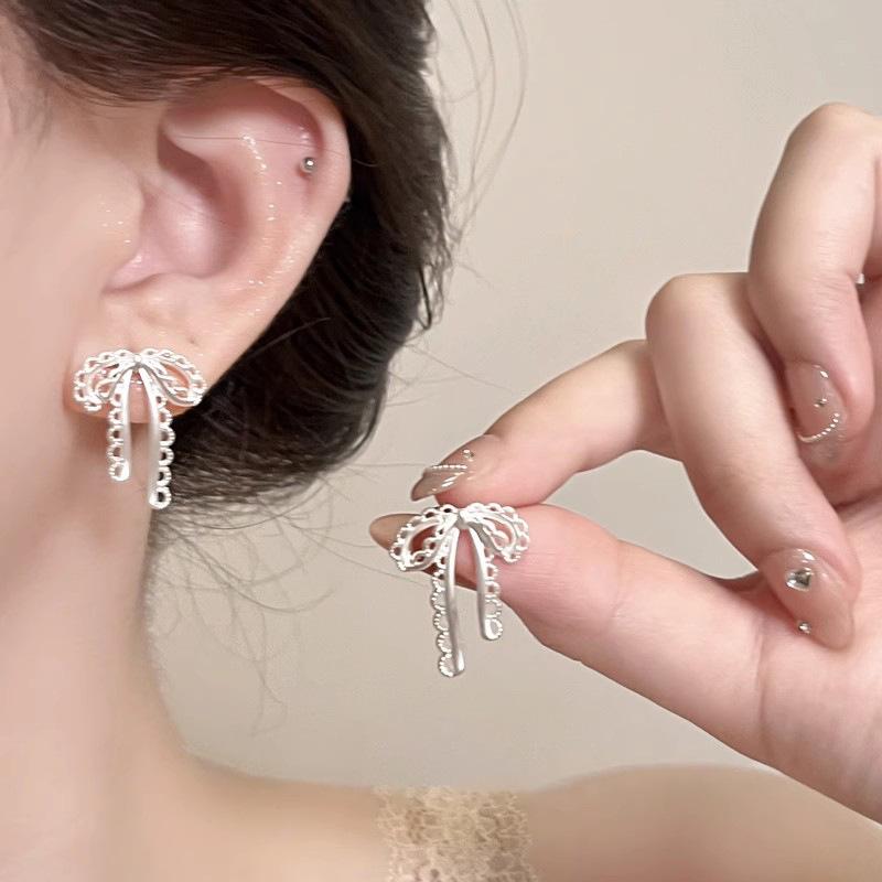 

Ballet Bow Earrings Matte Silver Hollow Design Ribbon Earrings Exquisite Sweet Earrings