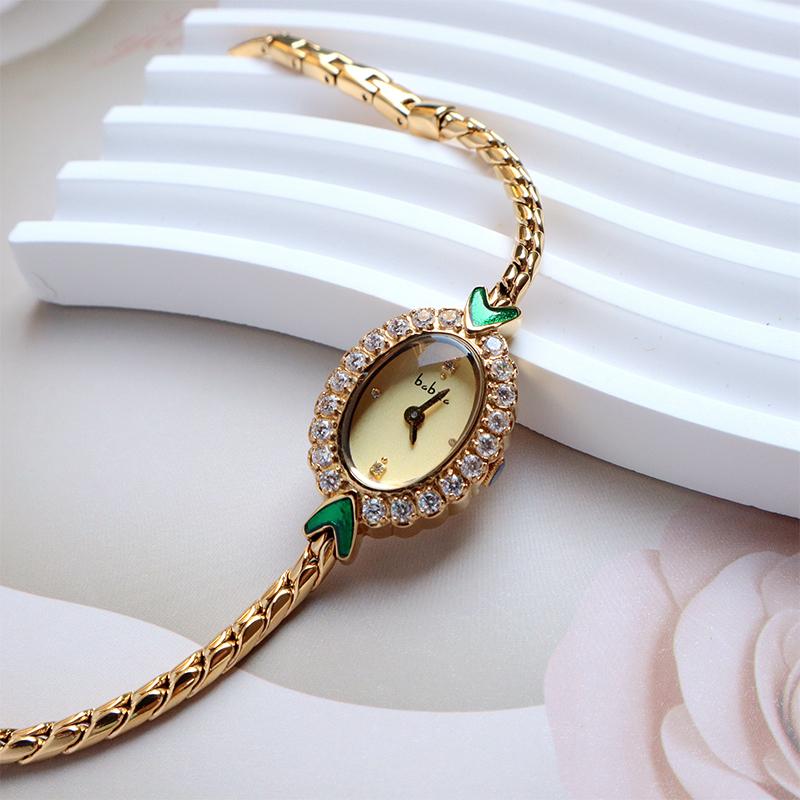 Meerjungfrau Armband Damen Armbanduhr Light Luxury Armbanduhr Mittelalterlich Exquisit Einfach Diamantbeschichtet 18 Karat Gold Smaragd