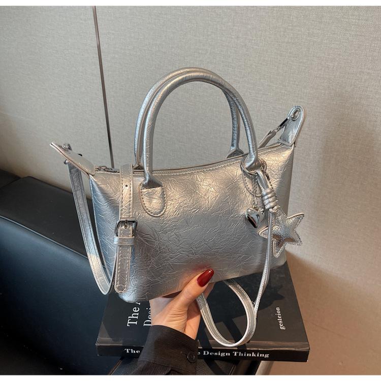 

Fashion burst pattern portable small bag women 2025 new high-end versatile dumpling bag retro shoulder messenger bag серебряный