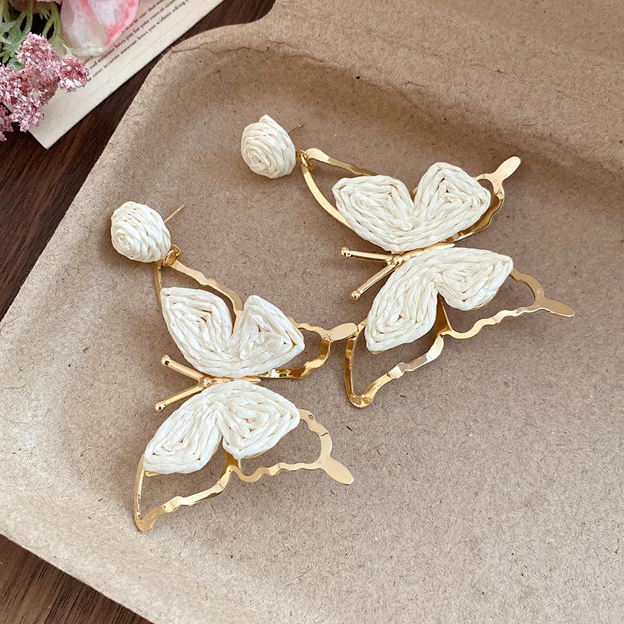 

Seaside vacation wind silver needle raffia butterfly pendant earrings simple fashion stud earrings niche high-end earrings women
