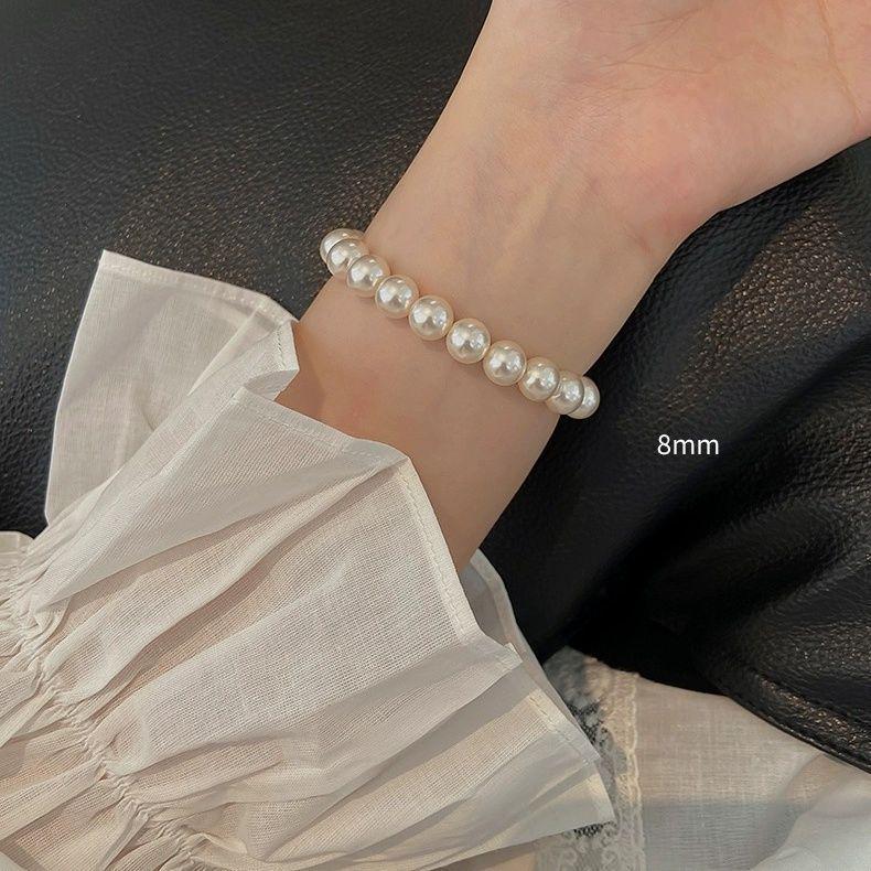 Elegant Multi-Piece Faux Pearl Bracelet for Women - Versatile, Elastic, and Stackable.