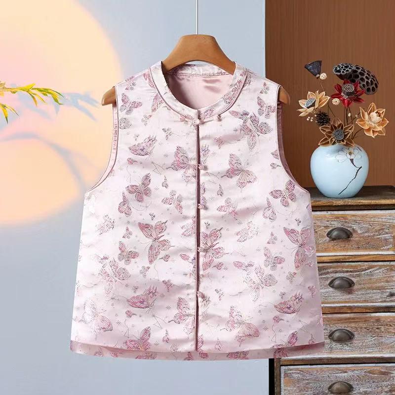 Ethnischer Jacquardstoff für Damen- und Kinderbekleidung in Rosa, Lila, Rot und Gold.