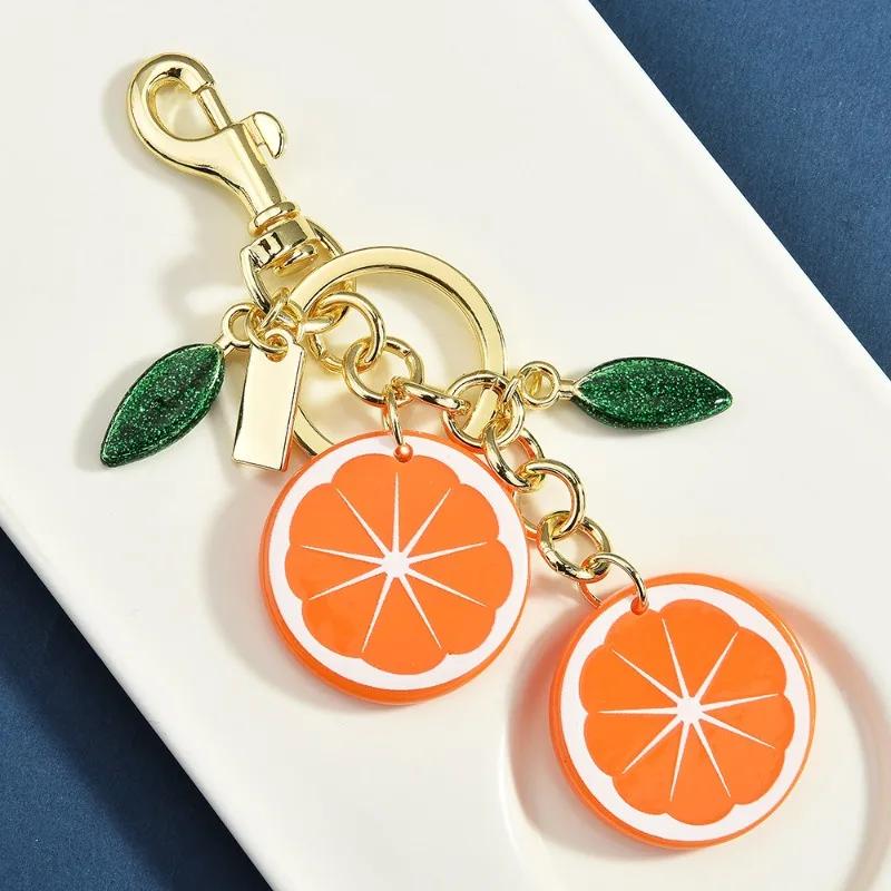 Women's fruit key chains, fashionable and creative lemon and orange slice bag pendants, keychains