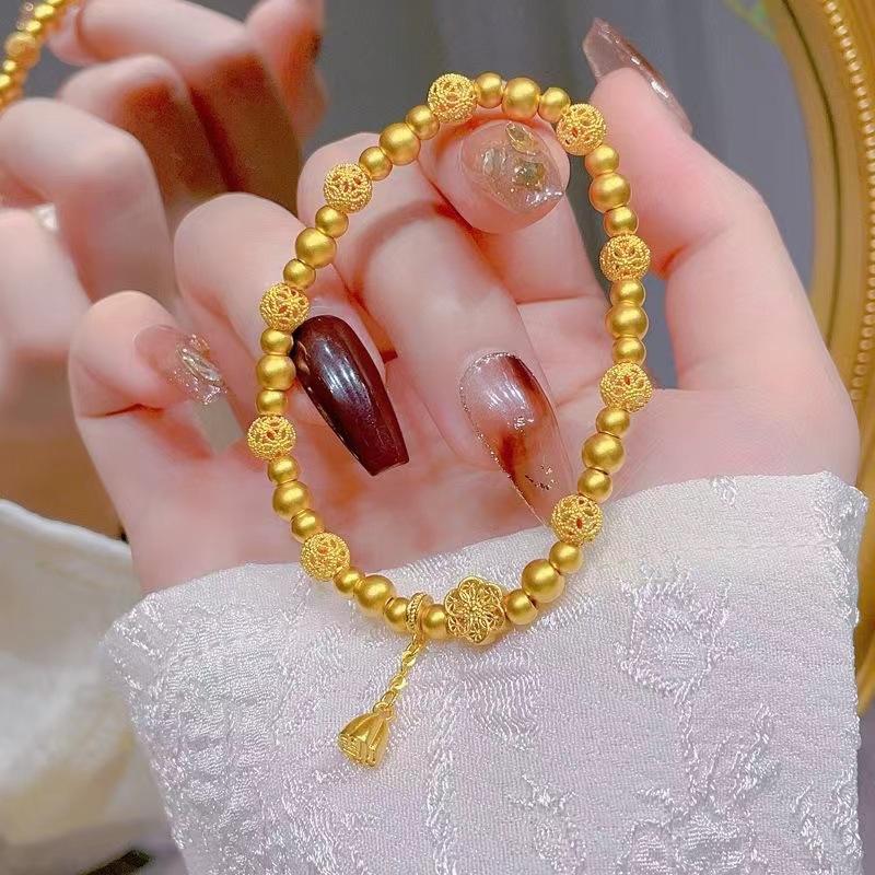 

Браслет из желтого золота с маленькими бусинами-переносками в виде цветков персика, женский, высококлассный, с темпераментным элементом, полый браслет-браслет