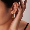 Hochwertige hypoallergene Titan-Creolen mit Sonnenanhänger aus 18 Karat Gold