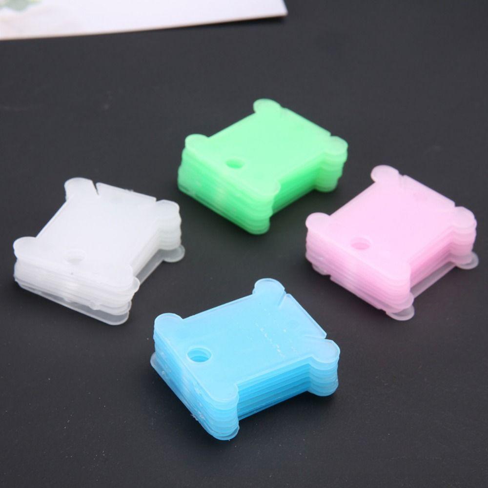 

100 шт. / Упаковка Пластиковая шпулька Намотчик Швейная машина Органайзер для проволоки Струнные намотчики Компьютерный автомобиль