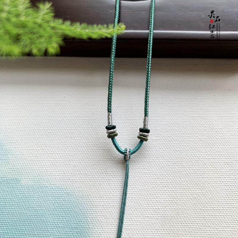 

Hand-Woven Jadeite Jade Necklace with Peace Buckle and Amber Pendant, Adjustable 2m Cord for Men and Women.