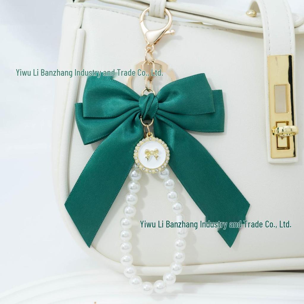 Large Bow Faux Pearl Bracelet Keychain with Colored Woven Strap and Alloy Tag Pendant