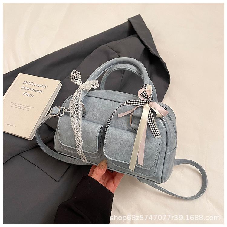 Versatile Korean version ins fashionable new portable Boston bag foreign style solid color oily skin niche simple messenger women's bag