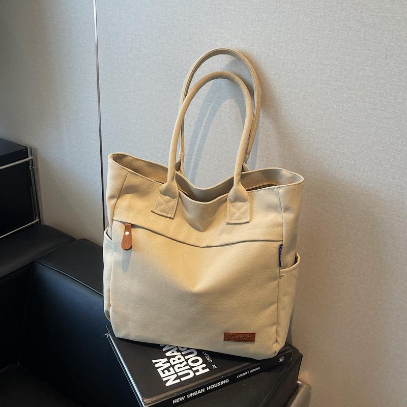 Casual large-capacity canvas bag women's new fashion commuter versatile shoulder bag college student tote bag