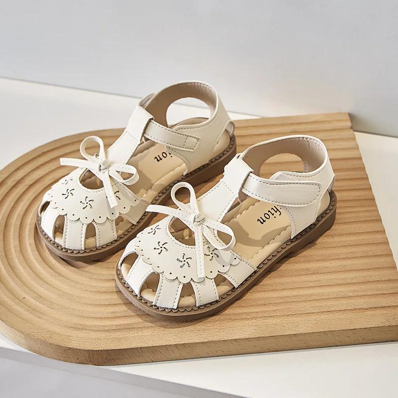 

Детская обувь принцессы 2024 года, летние новые сандалии для девочек с милым бантом, пляжная обувь для девочек на пуговицах для отпуска, универсальные модные туфли на плоской подошве 24 бежевый