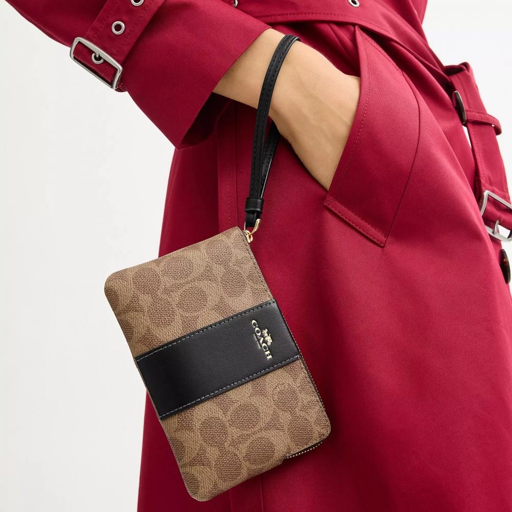 Coach Corner Zip Wristlet In Signature Canvas With Stripe Gold Tan Black